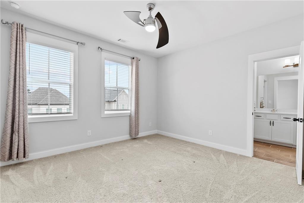 120 Meadow Mill Road Woodstock, GA 30188 - Photo 24 of 56 a view of an empty room with a window