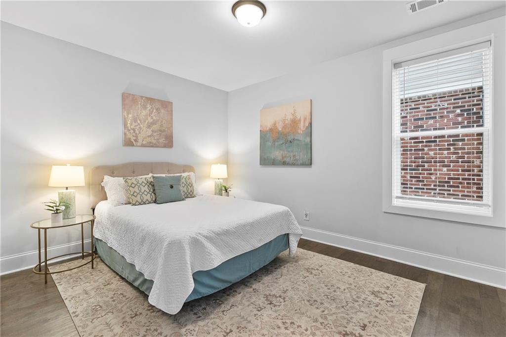 120 Meadow Mill Road Woodstock, GA 30188 - Photo 29 of 56 a bedroom with a bed and a window