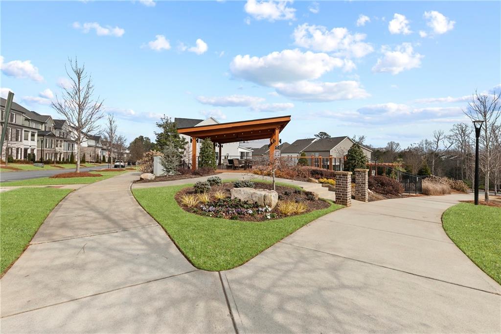 120 Meadow Mill Road Woodstock, GA 30188 - Photo 36 of 56 a front view of a house with garden