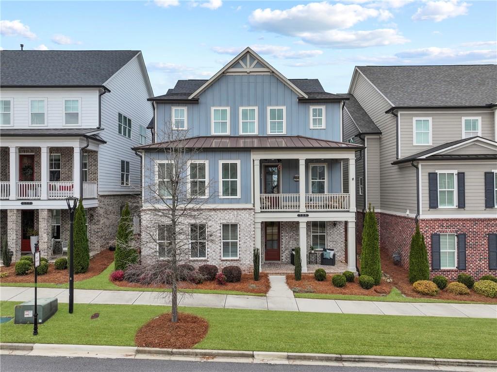 120 Meadow Mill Road Woodstock, GA 30188 - Photo 48 of 56 a front view of a house with a yard