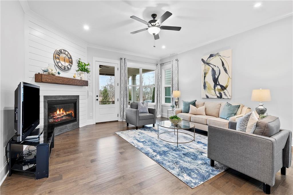 120 Meadow Mill Road Woodstock, GA 30188 - Photo 8 of 56 a living room with furniture and a fireplace
