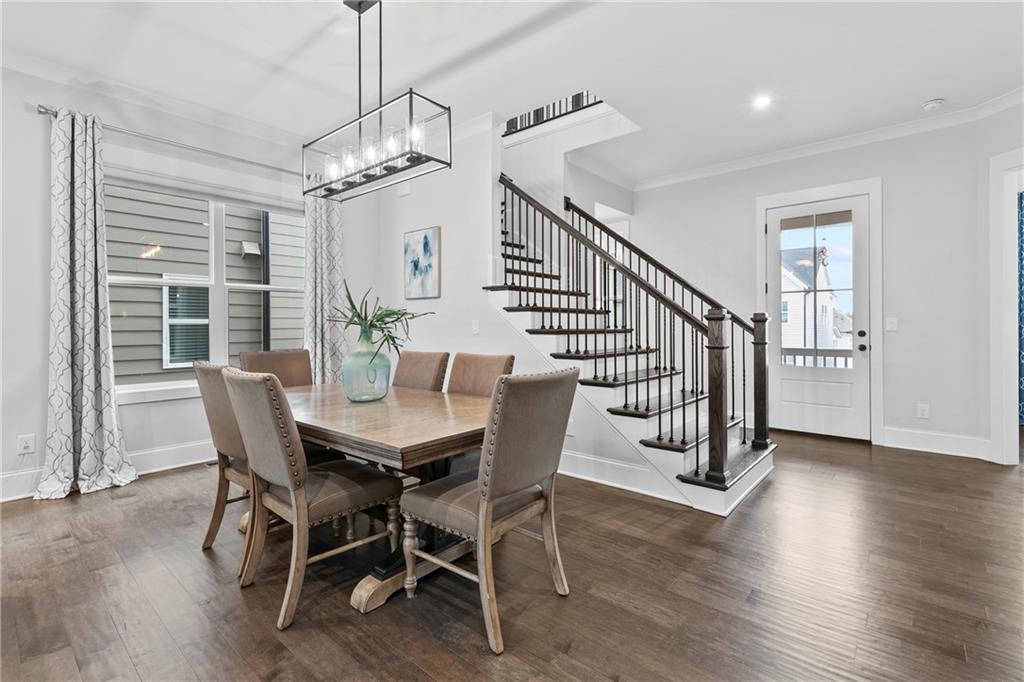 120 Meadow Mill Road Woodstock, GA 30188 - Photo 9 of 56 a view of a dining room with furniture window and wooden floor