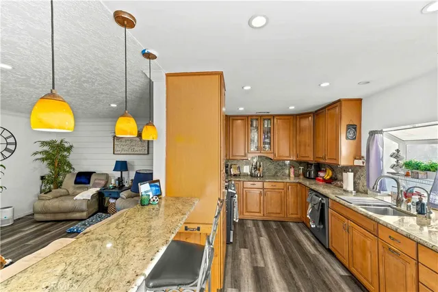 a kitchen with sink and stove
