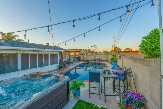 a view of a porch with furniture and a yard
