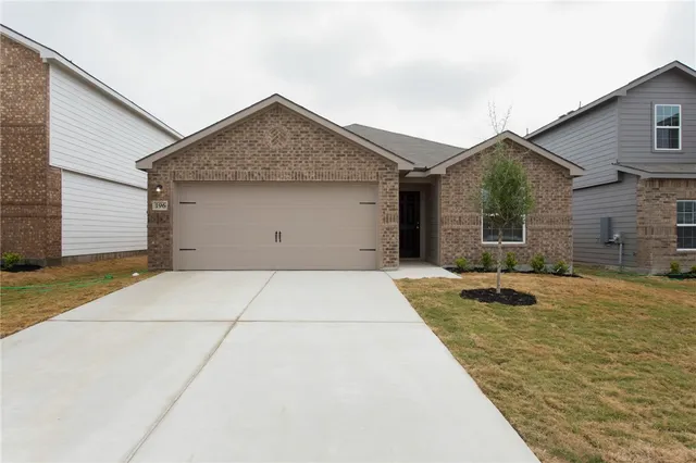 a view of garage and yard