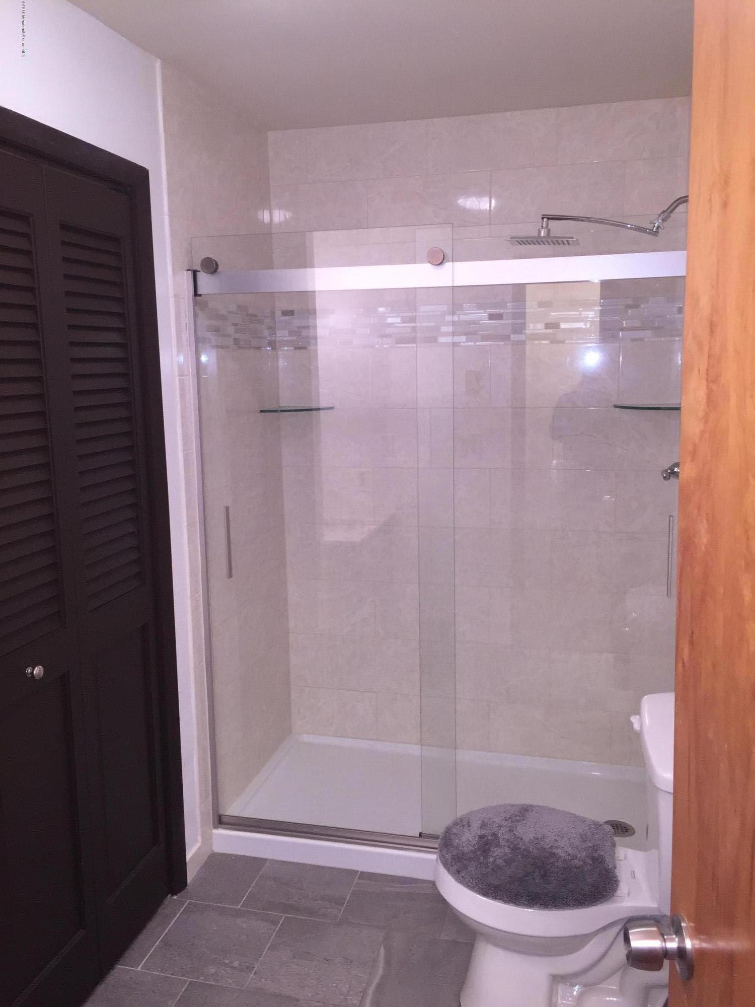 417 Couse Road Neptune Township, NJ 07753 - Photo 6 of 26 a bathroom with a shower and a toilet