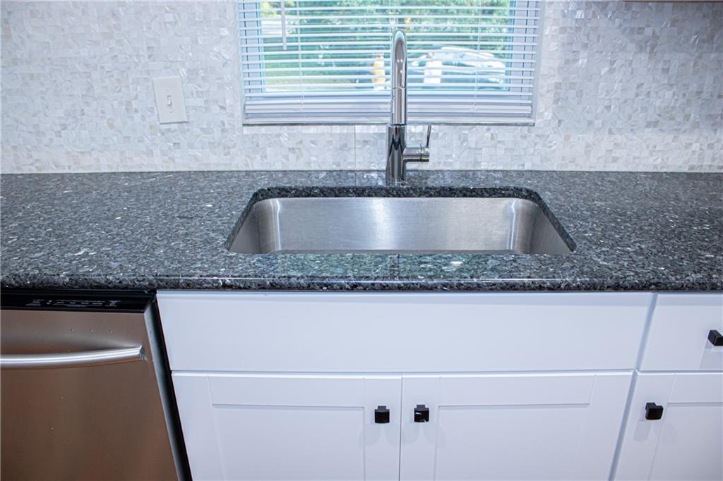 1962 Village Parkway Smyrna, GA 30080 - Photo 15 of 55 a kitchen with granite countertop a sink and a granite counter tops