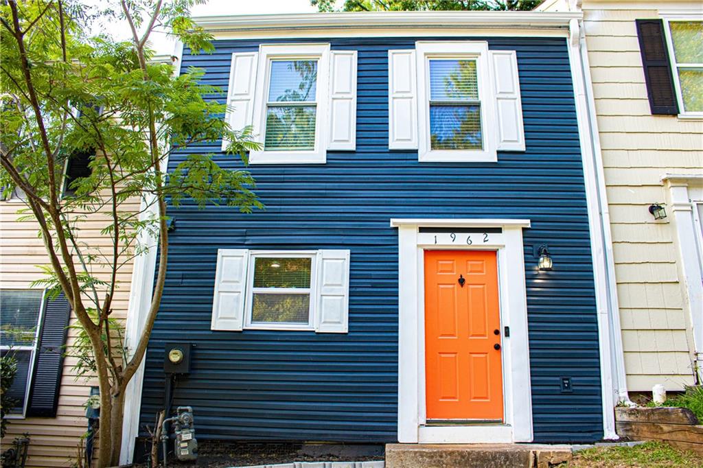 1962 Village Parkway Smyrna, GA 30080 - Photo 2 of 55 a view of a brick house with a large windows