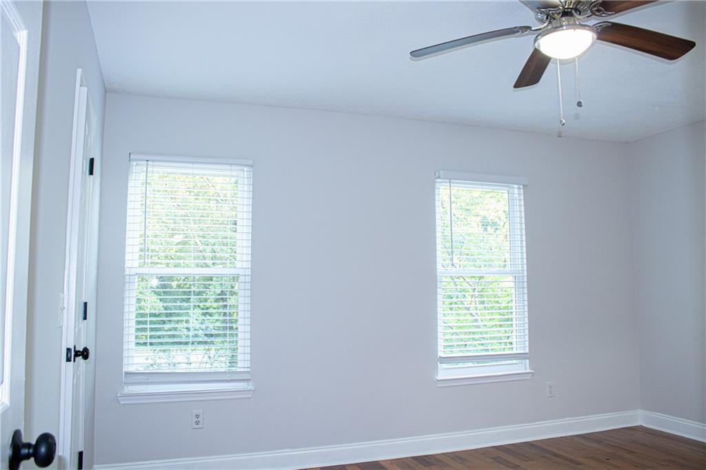 1962 Village Parkway Smyrna, GA 30080 - Photo 27 of 55 a view of an empty room with a window and wooden floor