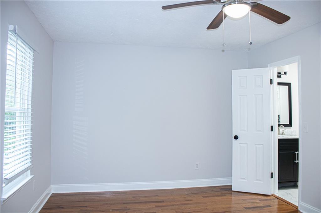 1962 Village Parkway Smyrna, GA 30080 - Photo 28 of 55 a view of an empty room with wooden floor and a window
