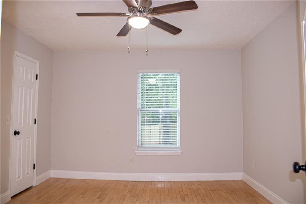 1962 Village Parkway Smyrna, GA 30080 - Photo 35 of 55 a view of an empty room with a window and a ceiling fan