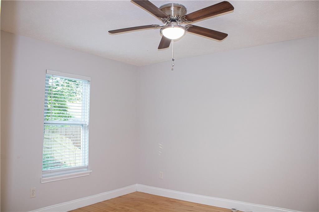 1962 Village Parkway Smyrna, GA 30080 - Photo 45 of 55 an empty room with a window and a fan