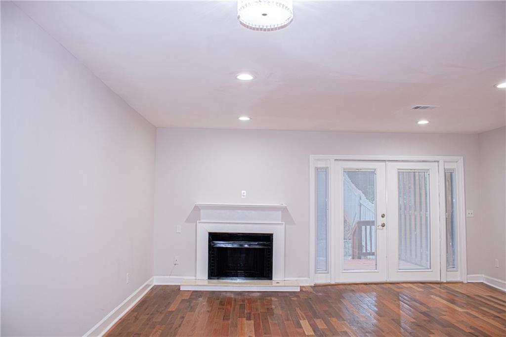 1962 Village Parkway Smyrna, GA 30080 - Photo 7 of 55 a view of a livingroom with wooden floor and a fireplace