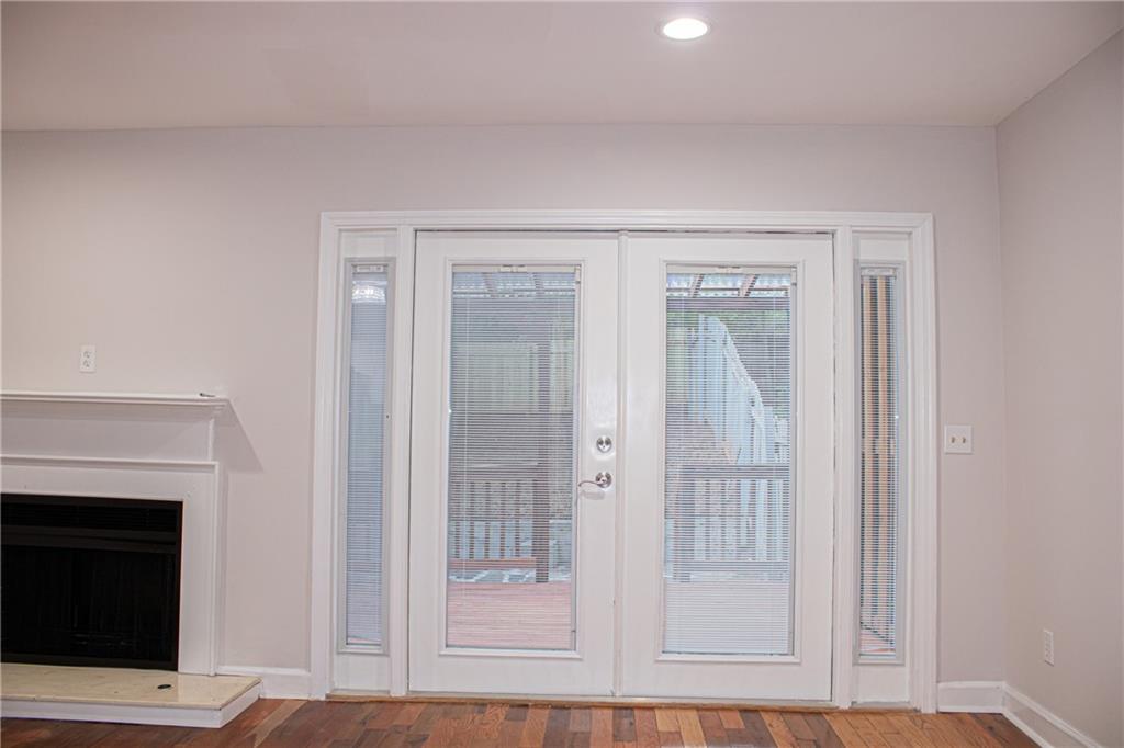1962 Village Parkway Smyrna, GA 30080 - Photo 10 of 55 a view of a livingroom with wooden floor and fireplace