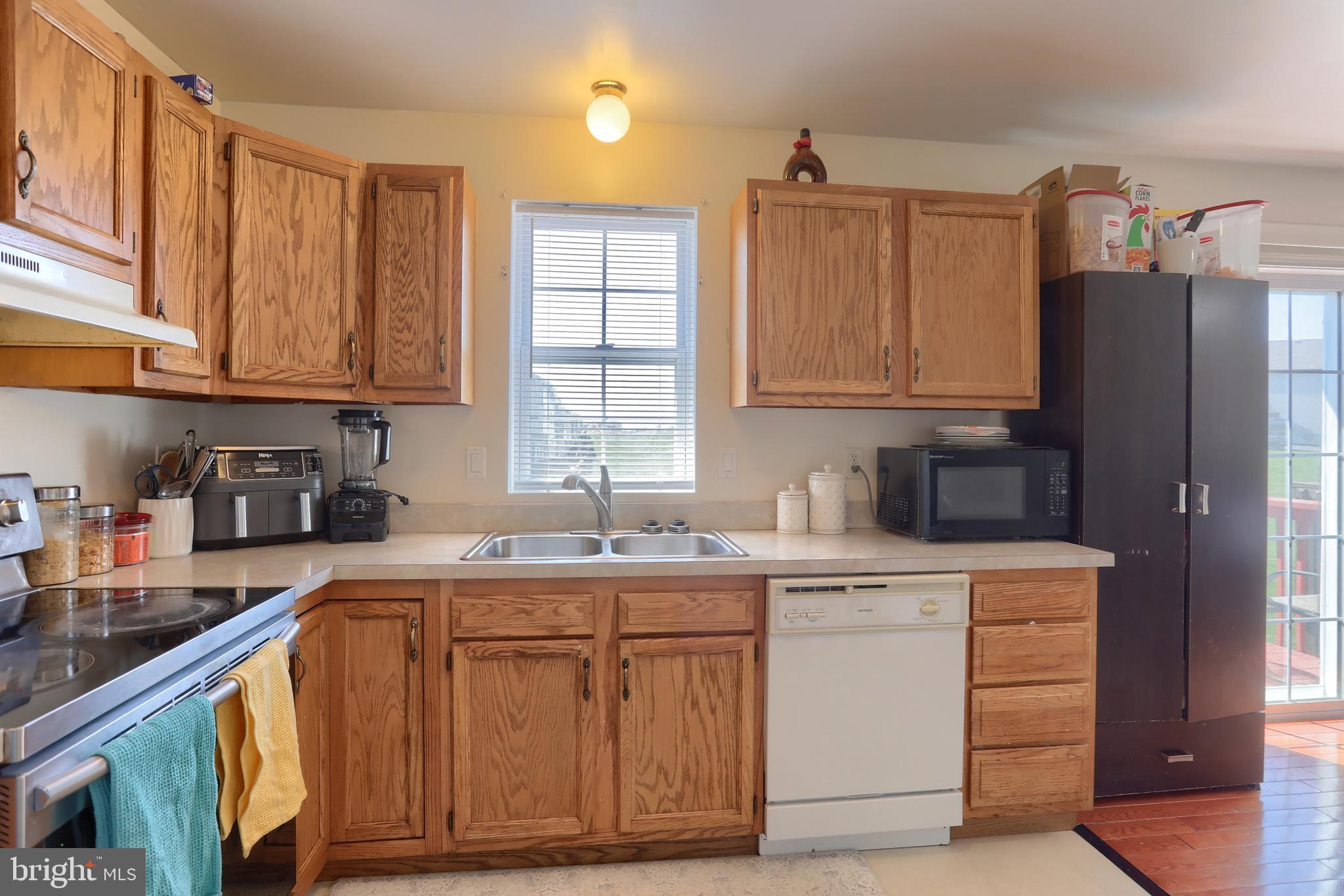 187 South 21st Street Lebanon, PA 17042 - Photo 12 of 31 a kitchen with stainless steel appliances granite countertop a sink stove and refrigerator