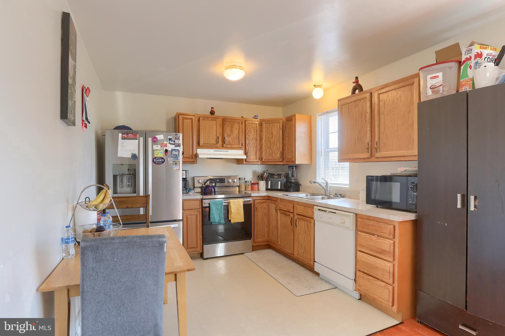 187 South 21st Street Lebanon, PA 17042 - Photo 13 of 31 a kitchen with stainless steel appliances granite countertop a refrigerator sink and stove