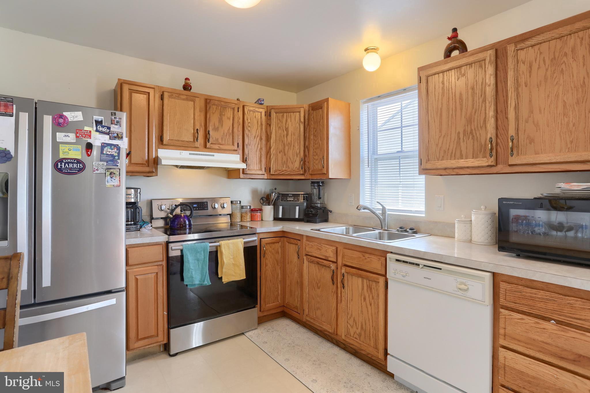 187 South 21st Street Lebanon, PA 17042 - Photo 14 of 31 a kitchen with stainless steel appliances granite countertop a refrigerator sink and cabinets