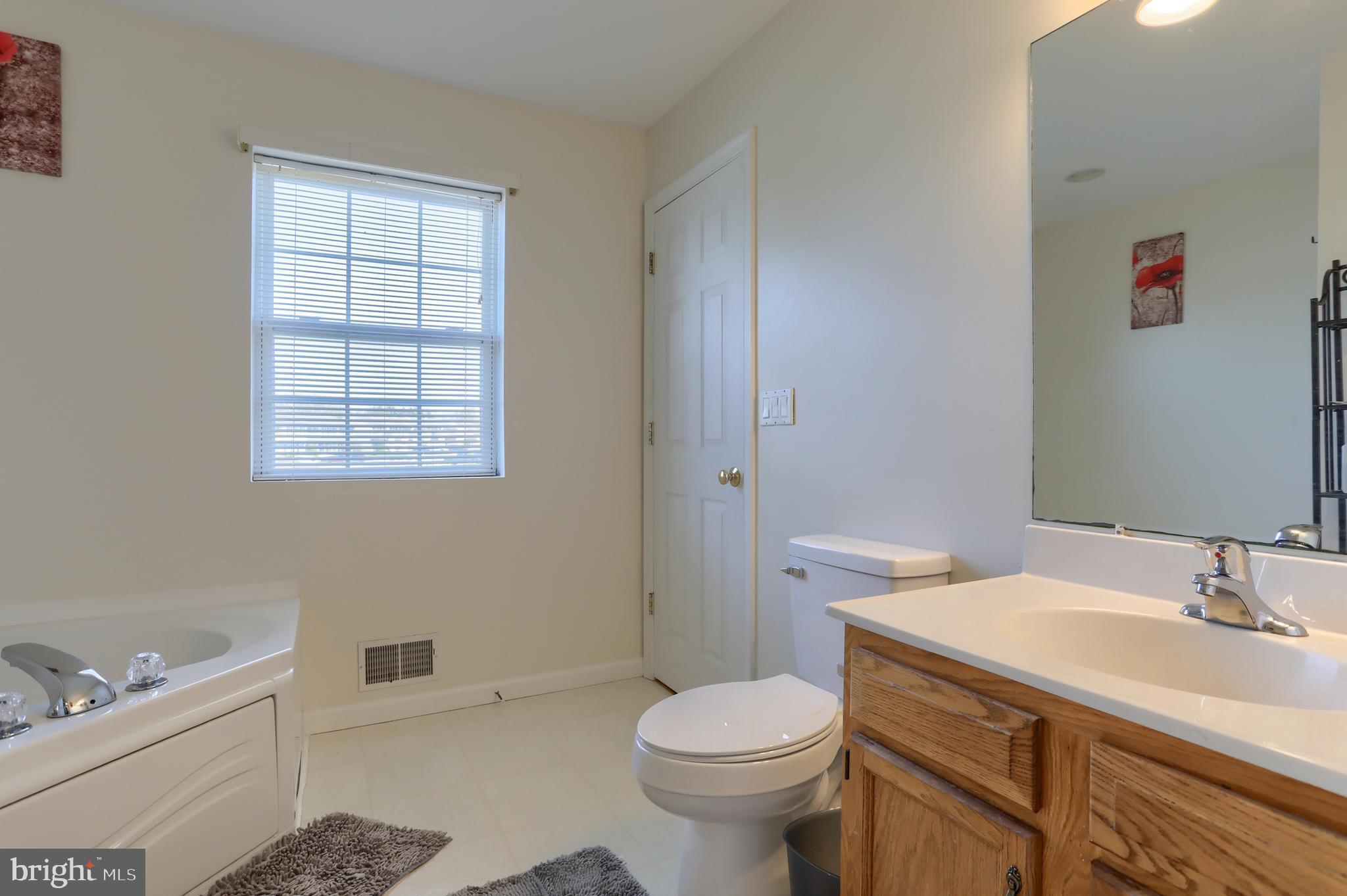 187 South 21st Street Lebanon, PA 17042 - Photo 16 of 31 a bathroom with a sink toilet and vanity