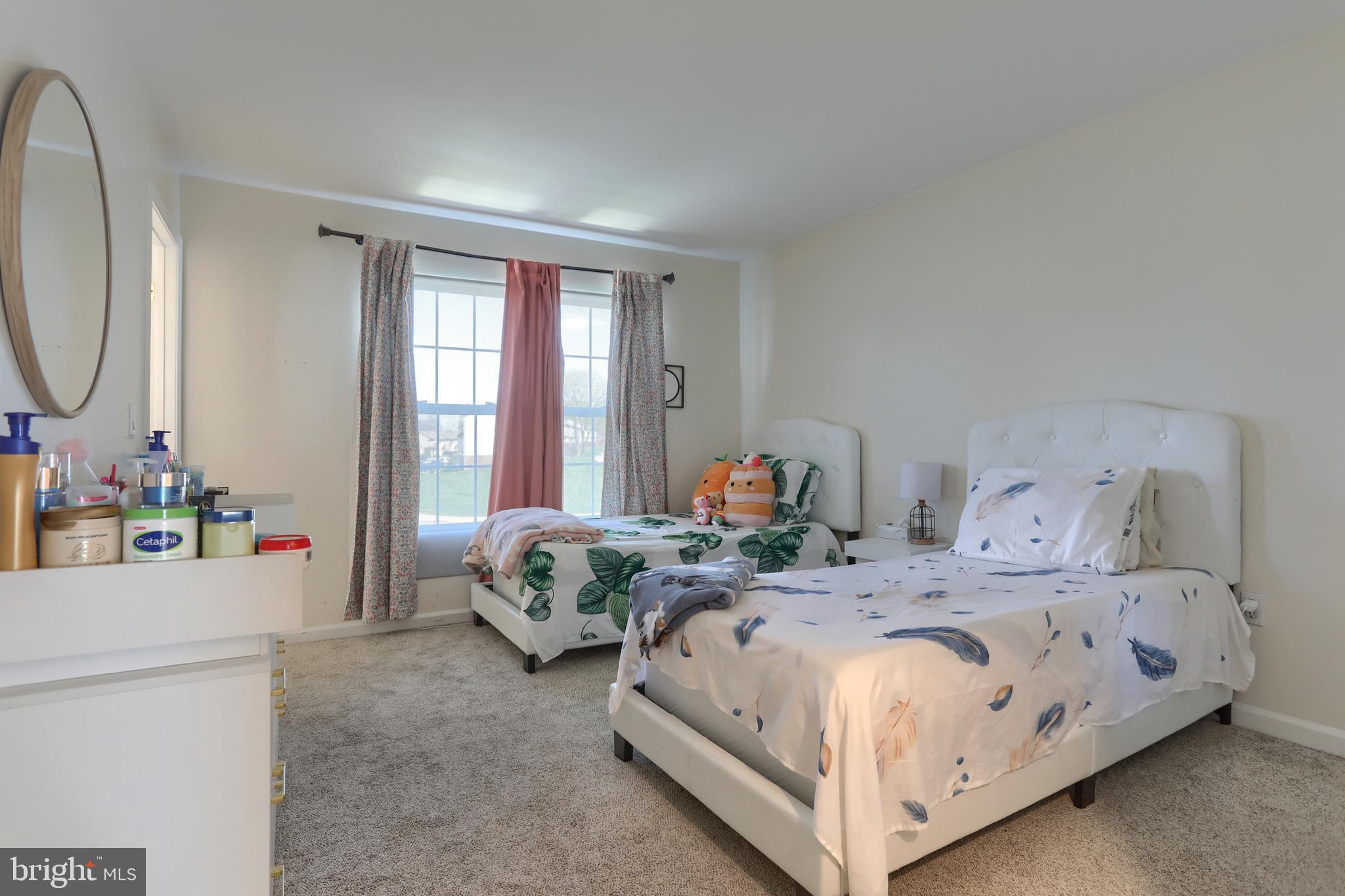 187 South 21st Street Lebanon, PA 17042 - Photo 19 of 31 a bed room with a bed and a mirror