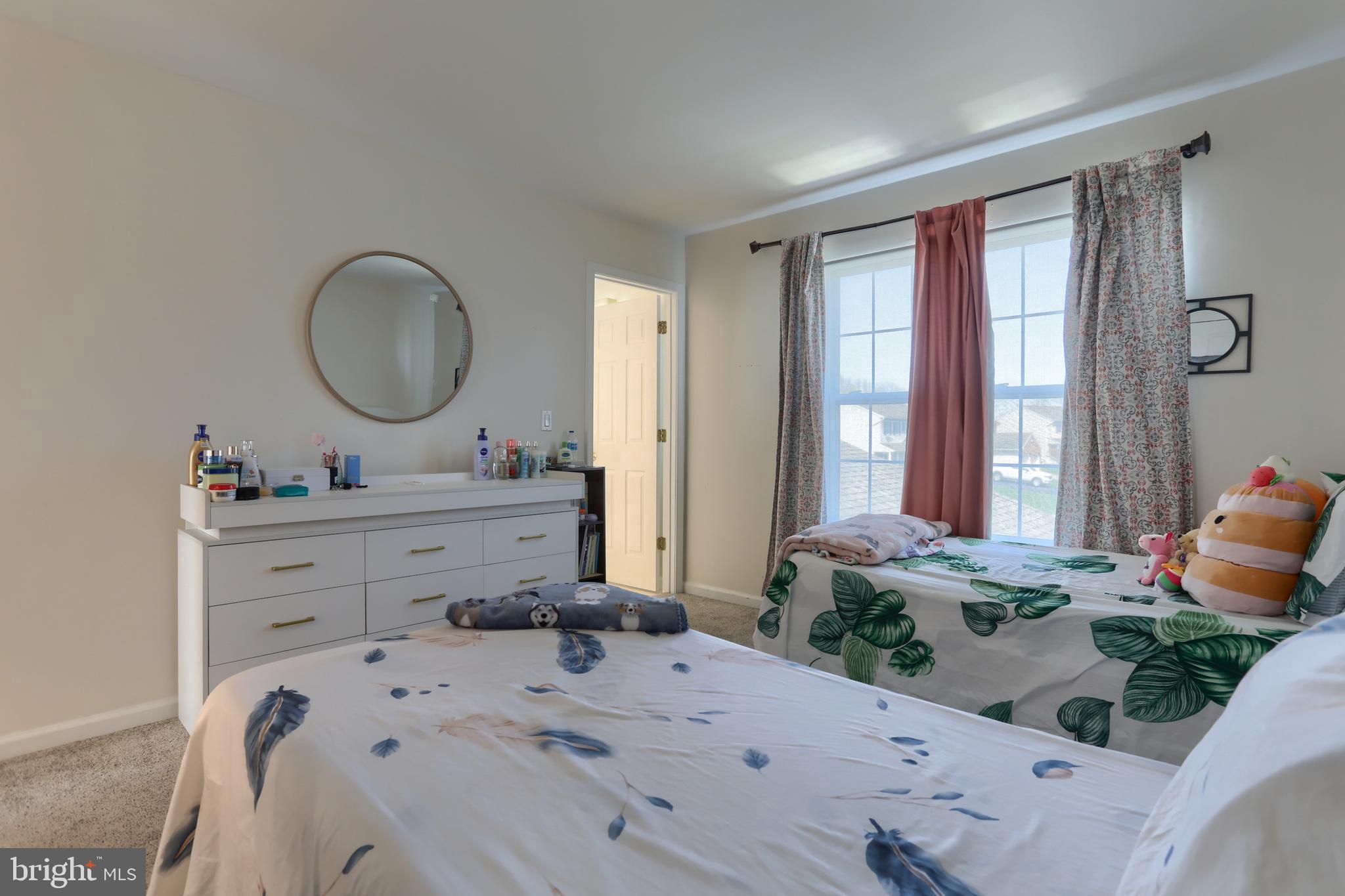 187 South 21st Street Lebanon, PA 17042 - Photo 20 of 31 a bedroom with a bed and large windows