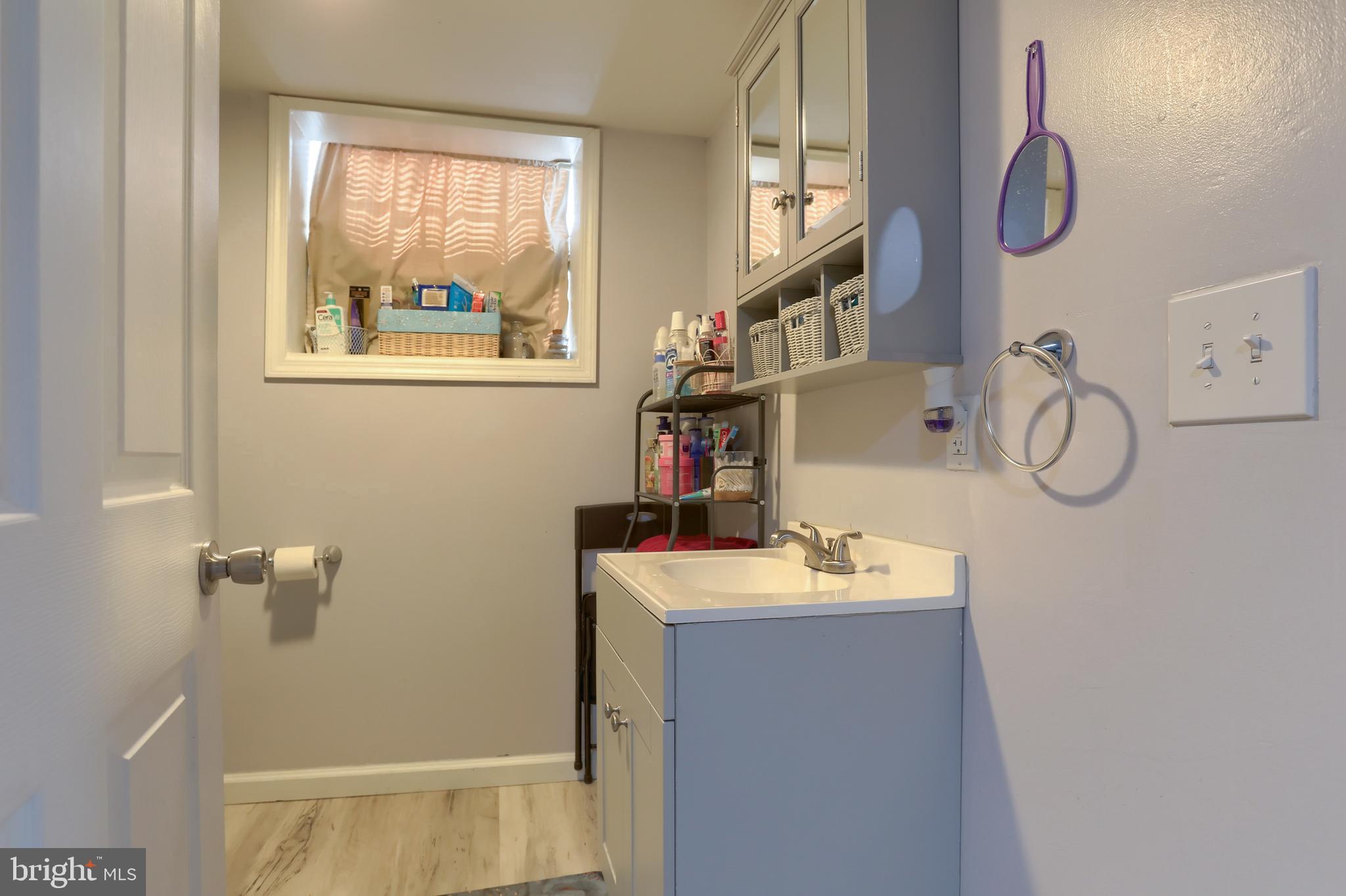 187 South 21st Street Lebanon, PA 17042 - Photo 27 of 31 a bathroom with a sink and a mirror