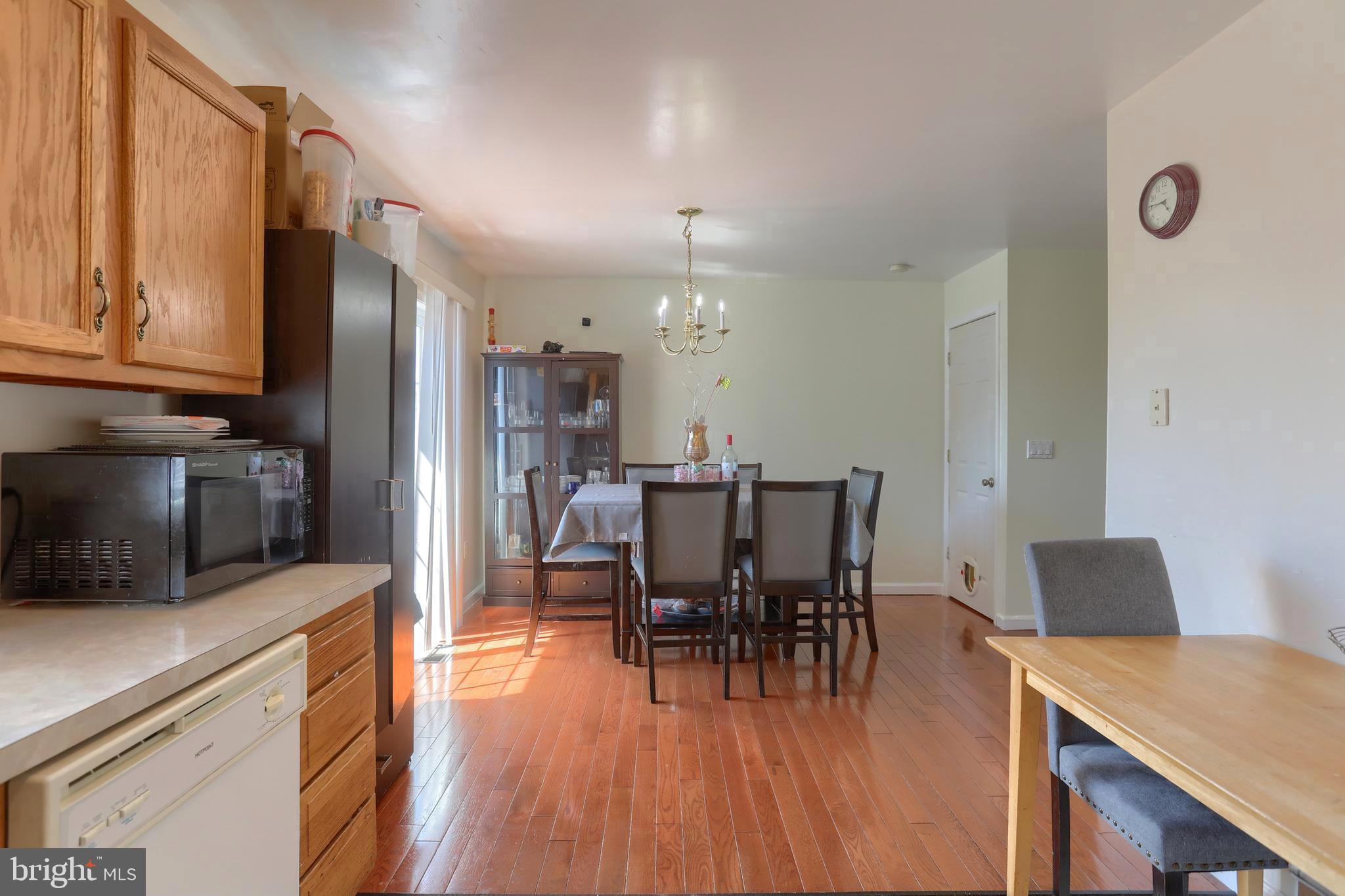 187 South 21st Street Lebanon, PA 17042 - Photo 9 of 31 a kitchen with stainless steel appliances a dining table chairs and a refrigerator