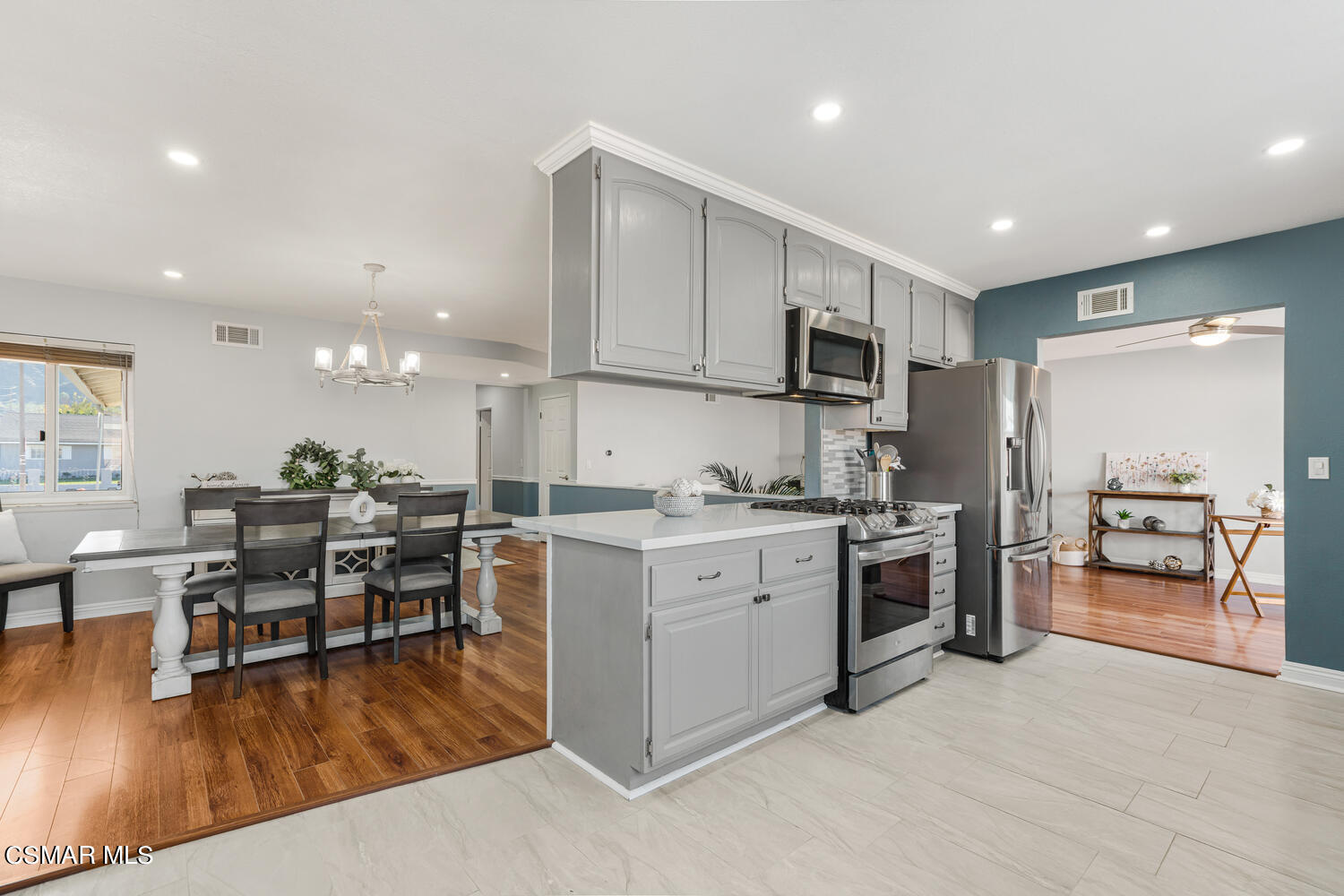 1735 Fitzgerald Road Simi Valley, CA 93065 - Photo 13 of 27 a kitchen with cabinets and wooden floor