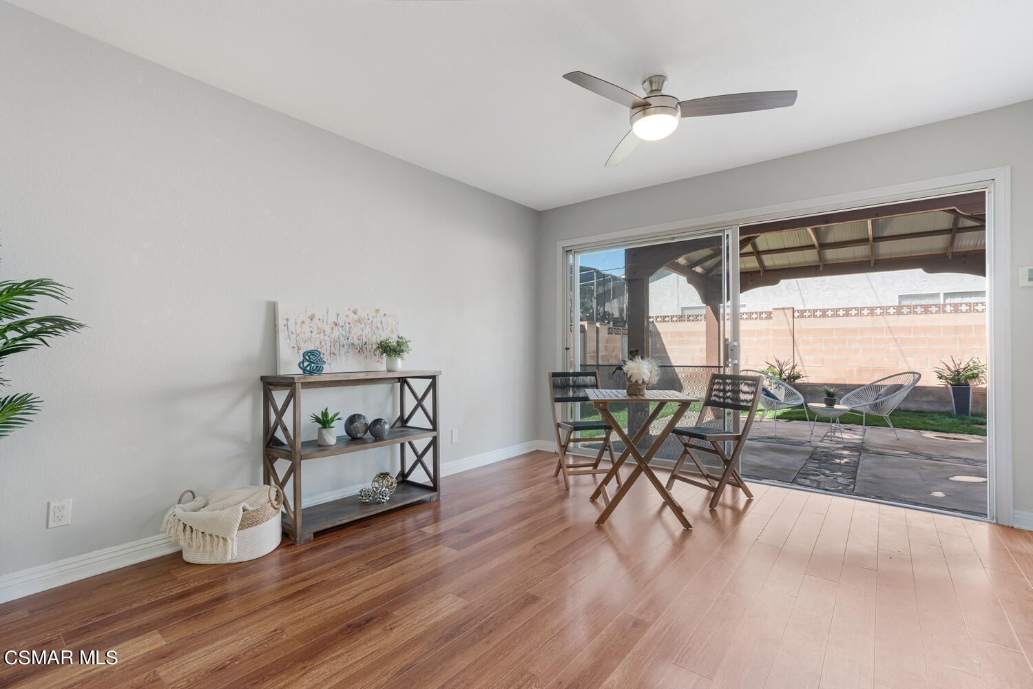 1735 Fitzgerald Road Simi Valley, CA 93065 - Photo 6 of 27 a dining room with furniture a potted plant and a floor to ceiling window