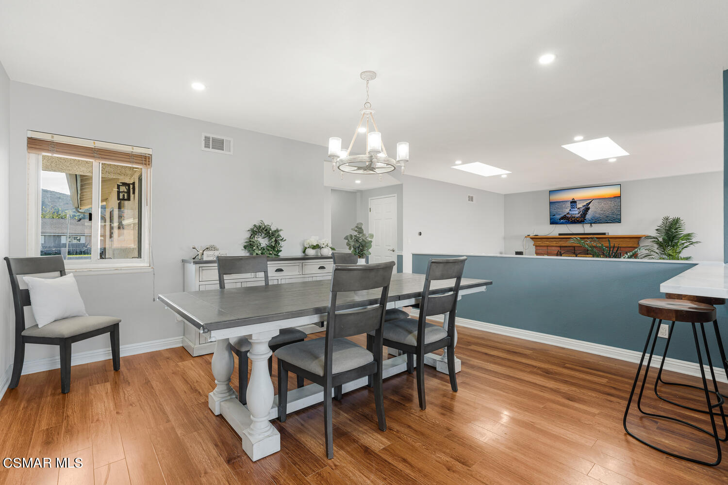 1735 Fitzgerald Road Simi Valley, CA 93065 - Photo 8 of 27 a view of a dining room with furniture and wooden floor