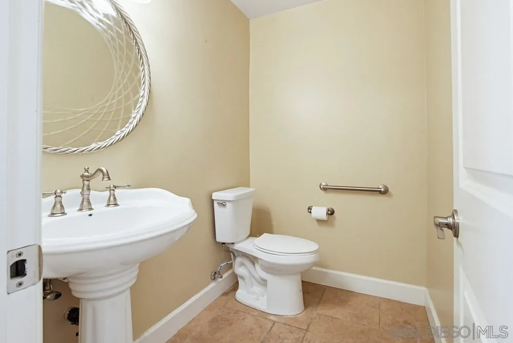12858 Stone Canyon Road Poway, CA 92064 - Photo 22 of 57 half bath in Foyer opposite of the coat closet