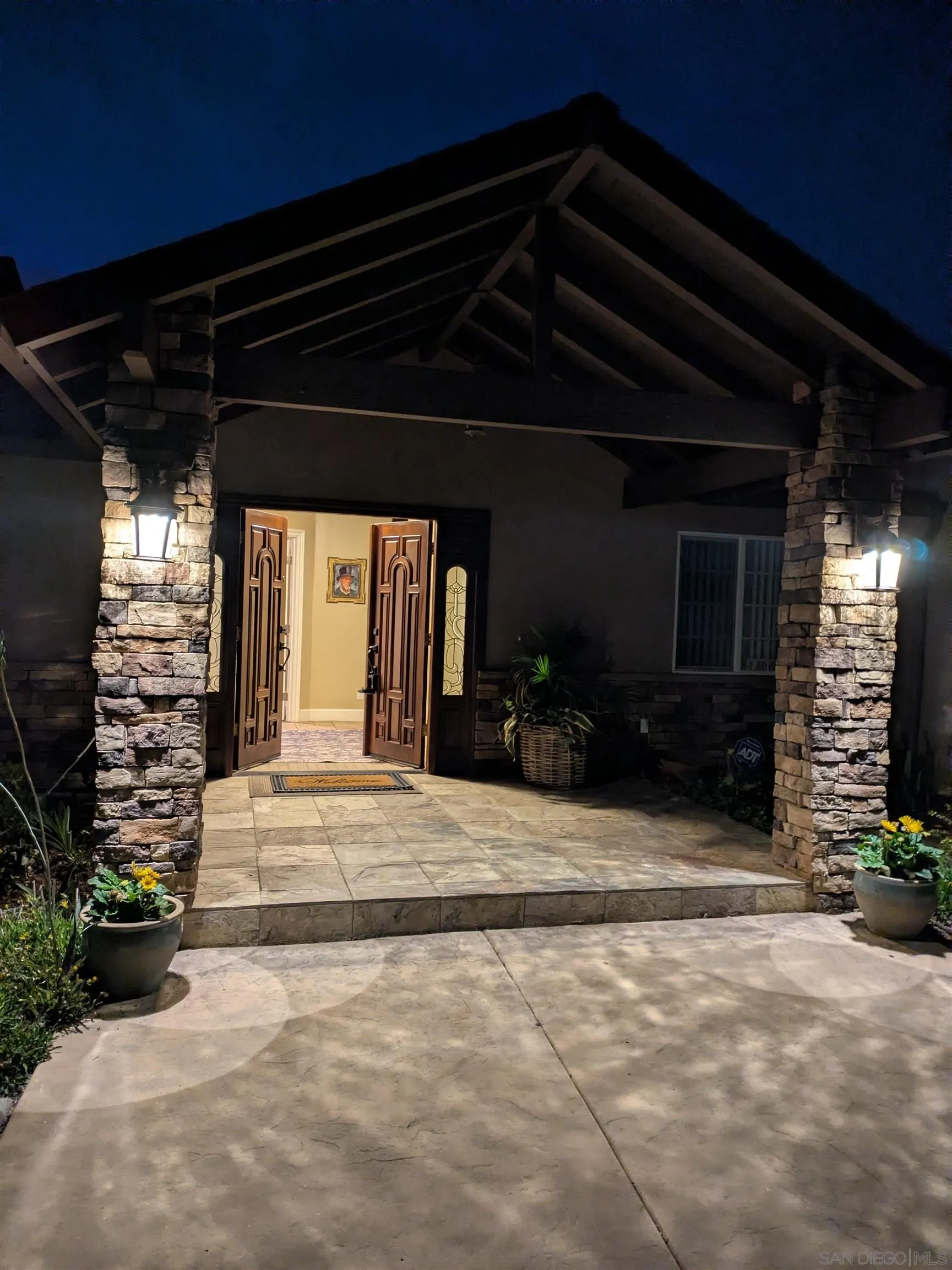 12858 Stone Canyon Road Poway, CA 92064 - Photo 55 of 57 Stone Pillar Lanterns Accent the entry at night