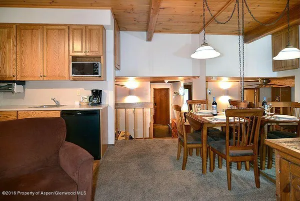 a view of a dining room with furniture