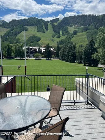 a view of a two chairs on the roof deck