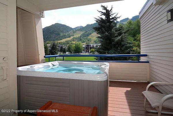a view of swimming pool with a lounge chair