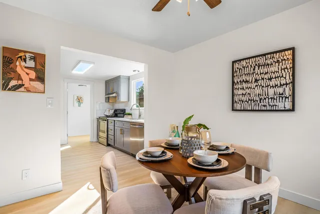 a view of a dining room with furniture and wooden floor