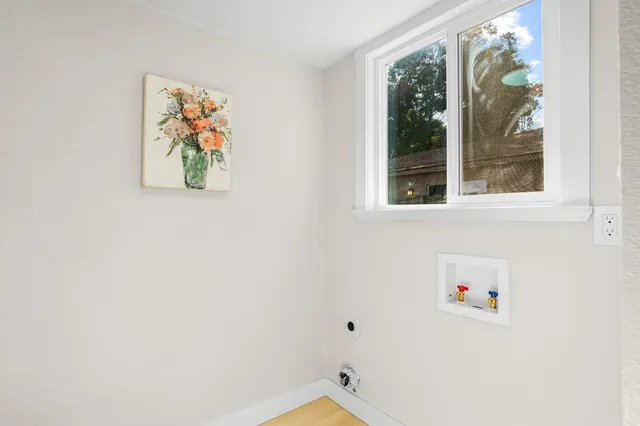 a view of hallway with bathroom