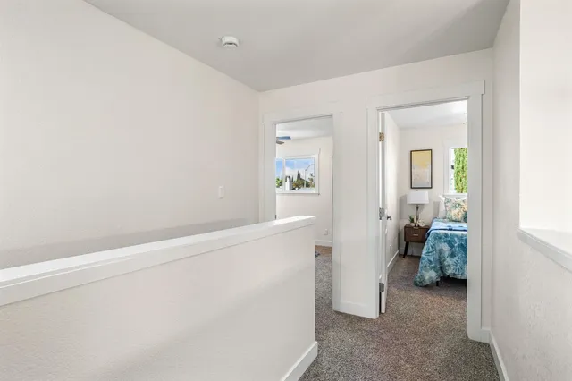 a view of hallway with natural light