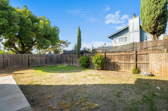a view of a backyard with a small cabin