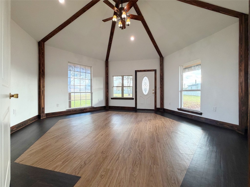 369 Road 3556 Cleveland, TX 77327 - Photo 12 of 16 an empty room with wooden floor and windows