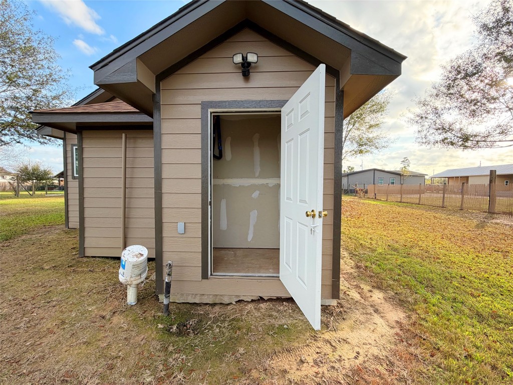 369 Road 3556 Cleveland, TX 77327 - Photo 14 of 16 a front view of a house with garden