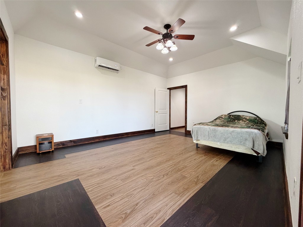 369 Road 3556 Cleveland, TX 77327 - Photo 7 of 16 a living room with couch and ceiling fan
