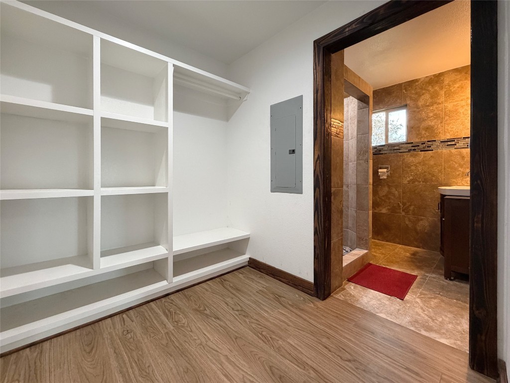 369 Road 3556 Cleveland, TX 77327 - Photo 9 of 16 a view of wooden floor and windows in a room