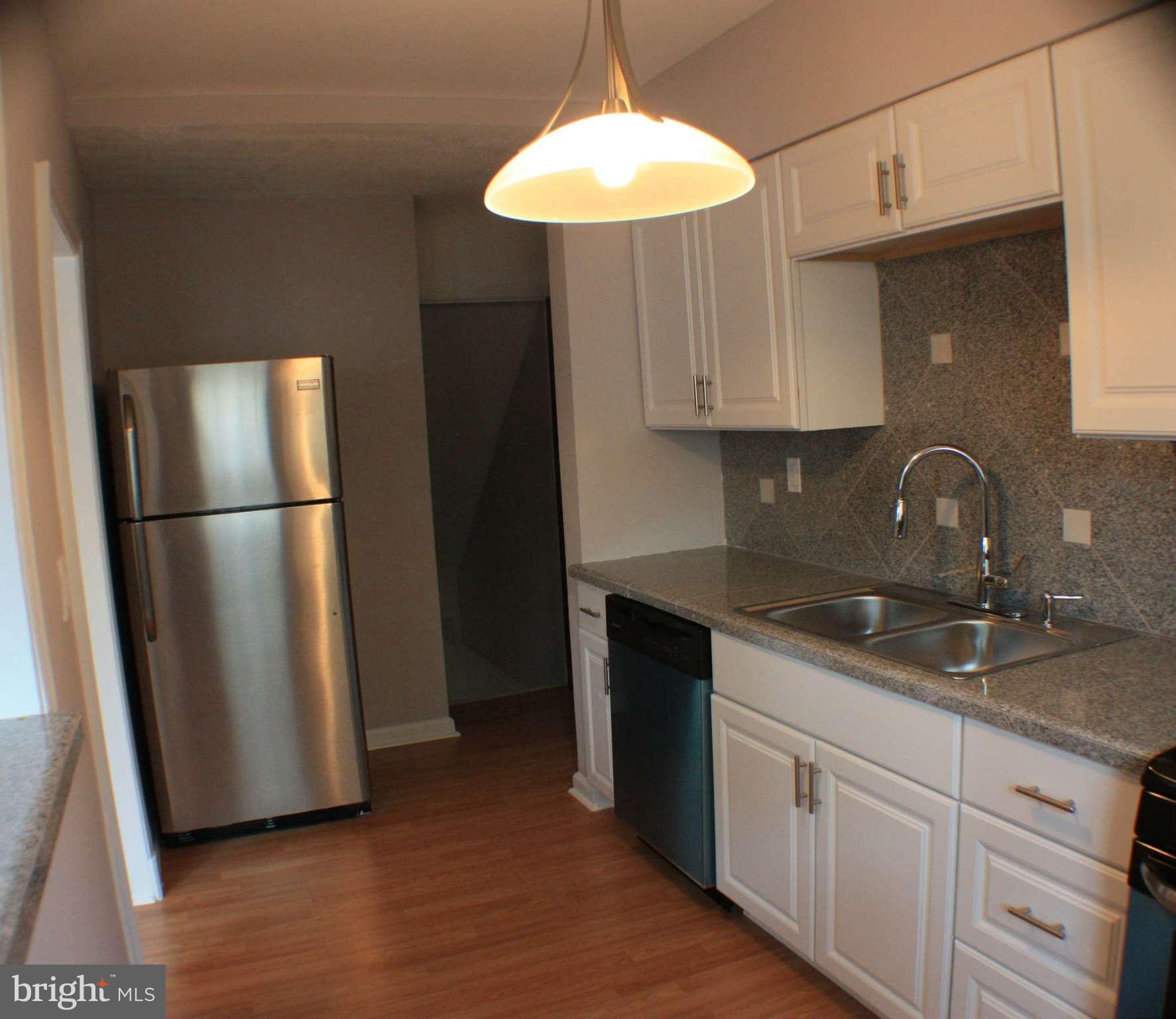 1540 Gleneagle Road Baltimore, MD 21239 - Photo 3 of 14 a kitchen with appliances and cabinets