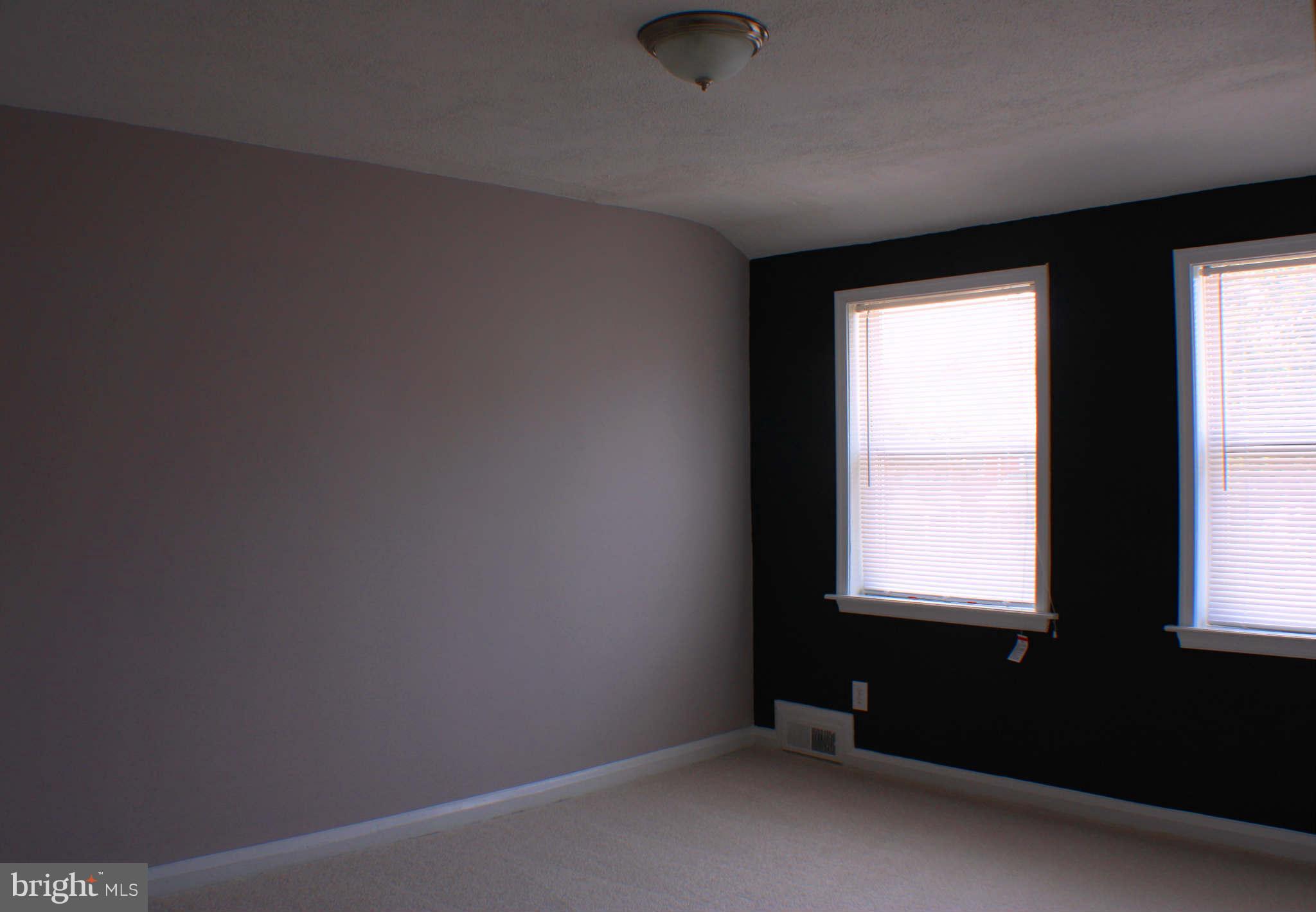 1540 Gleneagle Road Baltimore, MD 21239 - Photo 6 of 14 an empty room with a window