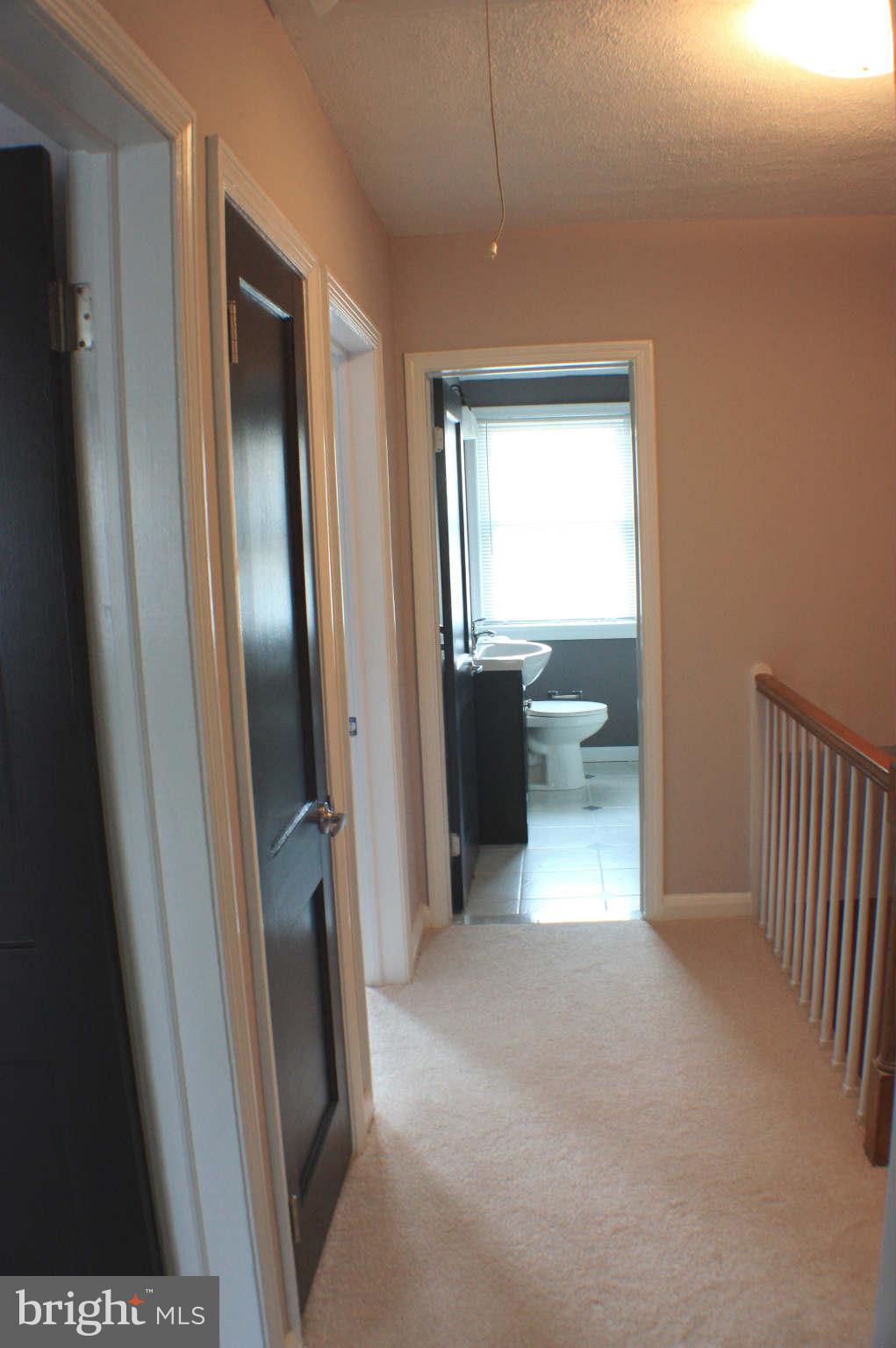 1540 Gleneagle Road Baltimore, MD 21239 - Photo 8 of 14 a view of livingroom with furniture and front door