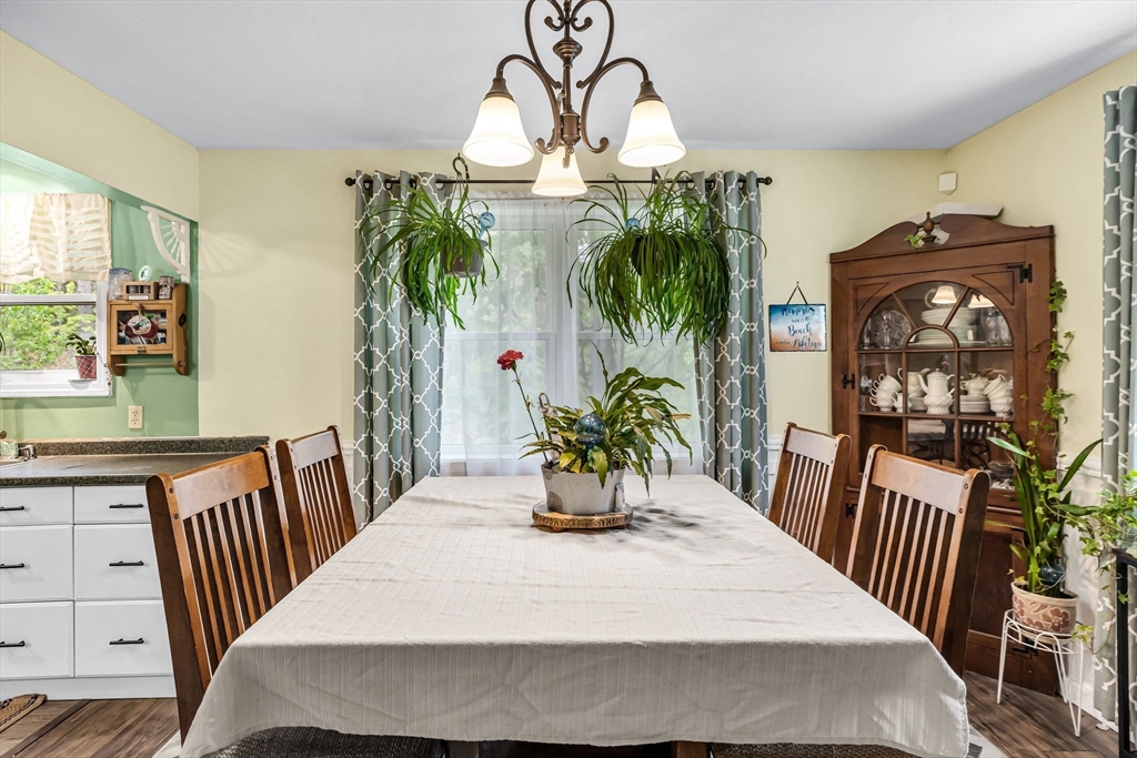 302 Middlefield Road Chester, MA 01011 - Photo 10 of 42 a dining room with furniture and wooden floor