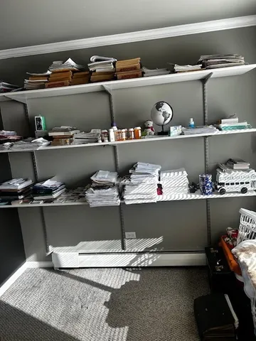 a shelf with cup and plates