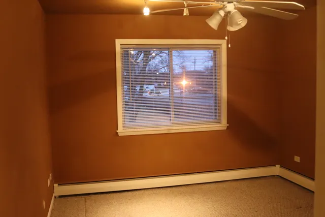 a view of a room that has a large window