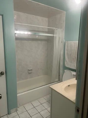 a bathroom with a bathtub and a sink