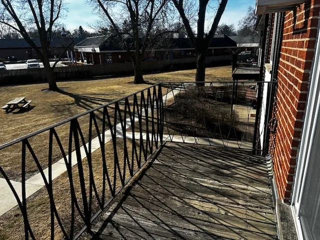 a view of backyard with a deck